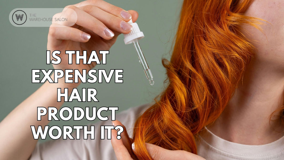 Stylish hair products lined up on a salon counter with a mix of luxury and drugstore brands.